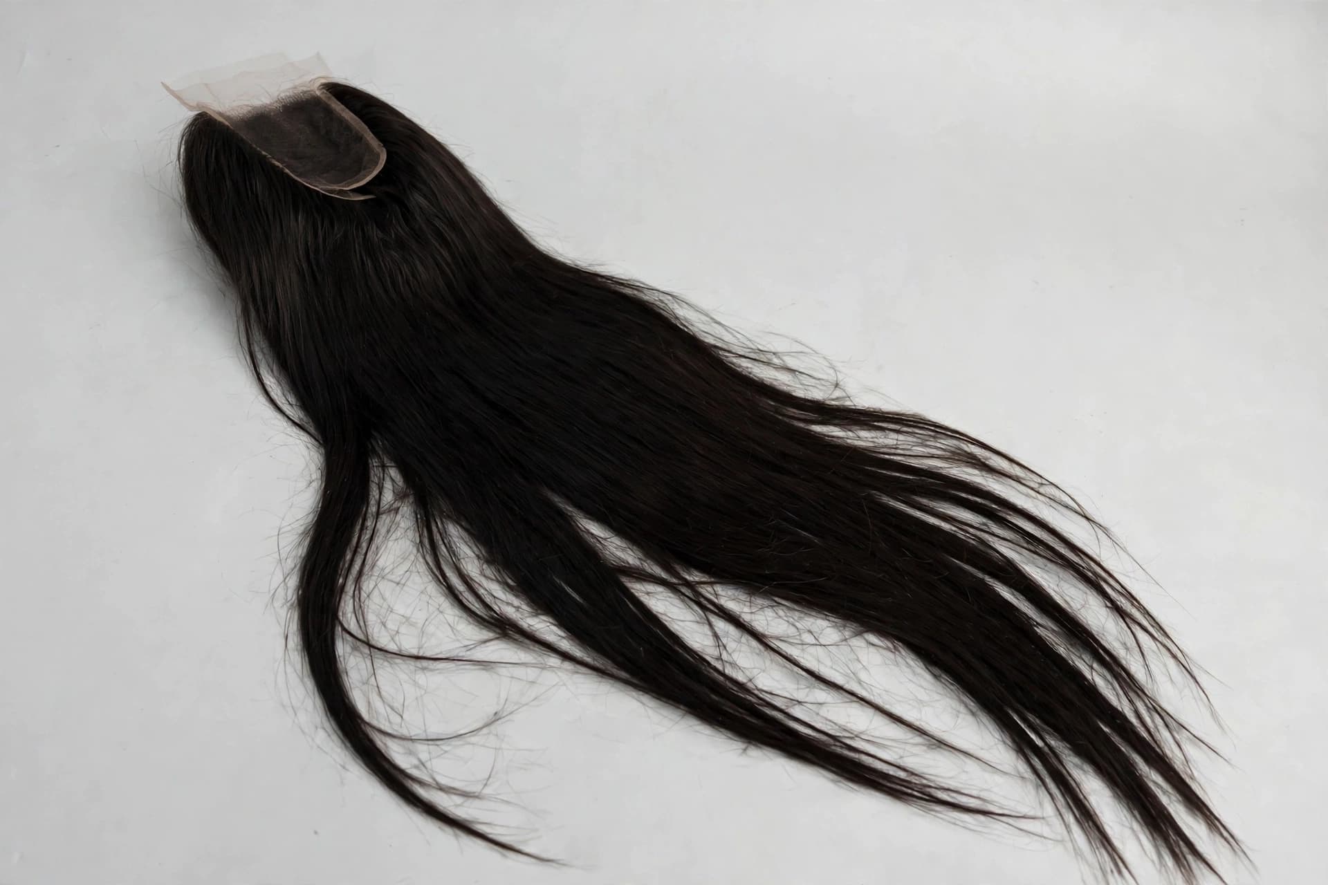AI-generated studio shot of the same bone straight wig on a clean branded background with soft lighting